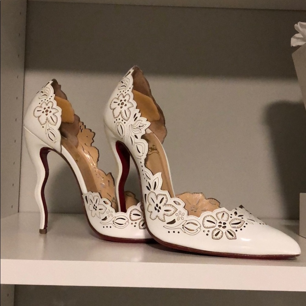 Louboutin crooked heal with red bottom